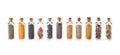 Row of small glass bottles with different spices Royalty Free Stock Photo