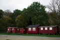 Row of small red fishing Danish wooden houses on the Baltic sea coast. SUMMER DANISH HOUSE. Frederiksvaerk. Denmark