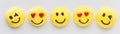 A row of smiley face emoji or emoticon merengue cookies. Royalty Free Stock Photo