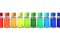 Row of sorted dropper bottles in spectrum colors Royalty Free Stock Photo