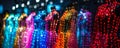 Row of sparkling LED light-embellished costumes on display, showcasing futuristic fashion with a dazzling array of vibrant