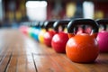 Row of sports dumbbells on the floor in the gym. Copy space. Healthy lifestyle and weight loss concept. Royalty Free Stock Photo