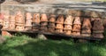 Clay pots on outdoor shelf