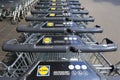 Row of stacked metal supermarket trolleys