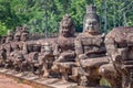 Row of statues at the entry gate of Angkor Siem Rep, Cambodia