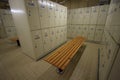 Row of steel lockers along the chair, Locker room for worker in job site, Keep personal belonging in sport complex.