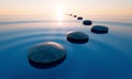 Stones in a calm sea at sunset