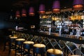 Row of stools and bar counter in empty cozy restaurant Royalty Free Stock Photo