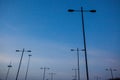 A row of street lights are lit up in the dark sky Royalty Free Stock Photo