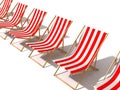 Row of striped red beach chairs on white