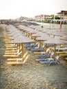 Row of sunshades on beach in morning Royalty Free Stock Photo