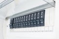 A row of switched off household electrical circuit breakers on a wall panel Royalty Free Stock Photo