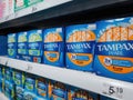 A row of Tampax Pearl female hygiene products on sale found on a shelf in a