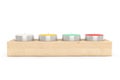 Row of Tea Light candles in wooden stand Royalty Free Stock Photo