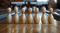 Row of Ten White Bowling Pins on Wooden Alley Royalty Free Stock Photo