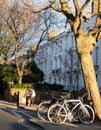 Row of terraced houses in Primrose Hill, London UK. Photographed on a cold, bright winter`s day with bicycles in foreground.