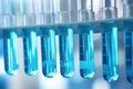 Row of test tubes filled with blue liquid. Perfect for scientific research and laboratory concepts Royalty Free Stock Photo