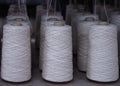 Row of textile threads industry .