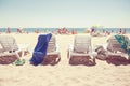 A row of three beach chairs overlooking the sea view