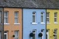 Row of three brightly coloured houses