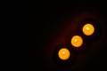 Row of three burning circle candles Royalty Free Stock Photo