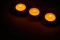 Row of three burning circle candles Royalty Free Stock Photo