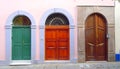 A row of three different arched doors