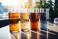 A row of three glasses of beer on a table. Perfect for pub scenes and beer-related designs Royalty Free Stock Photo