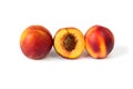 Row of three ripe peaches on the white background Royalty Free Stock Photo