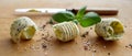 Row of three stylish butter curls with herbs Royalty Free Stock Photo