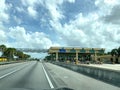 A row of toll booths for people to pay tolls for EPass and Sunpass in Orlando, Florida