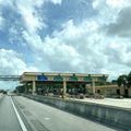 A row of toll booths for people to pay tolls for EPass and Sunpass in Orlando, Florida