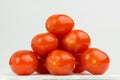 Row of tomatoes laid in a triangle shape. Heap of fresh tomatoes Royalty Free Stock Photo