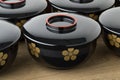 Row of traditional black lacquered Japanese bowls Royalty Free Stock Photo