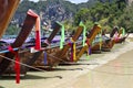 Row of traditional longtail boats in thailand