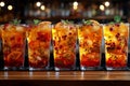 Row of tropical fruit cocktails in tall glasses, great for party and celebration themes. Royalty Free Stock Photo
