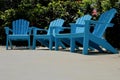 Row of Turquoise Blue Adirondack Chairs