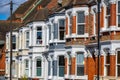 A row of typical British terraced houses in London with a telephone pole Royalty Free Stock Photo