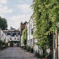 Row of typical mews houses in London, UK, street view
