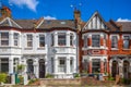 A row of typical brick English terraced houses in London