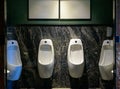 Row of urinal in Empty public men toilet Royalty Free Stock Photo