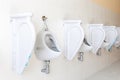 Row of urinal toilet blocks in men public toilet