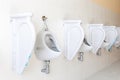 Row of urinal toilet blocks in men public toilet Royalty Free Stock Photo