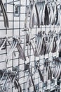 Row of various stainless steel dental extraction forceps tools hanging on display Royalty Free Stock Photo