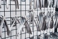 row of various stainless steel dental extraction forceps tools hanging on display Royalty Free Stock Photo