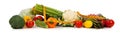 A row of vegetables and a tape measure on white Royalty Free Stock Photo