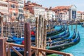 Row Of Venetian Gondolas Parked At Wooden Dock Royalty Free Stock Photo