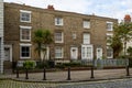 A row of Victorian terraced houses in old commercial road in Portsmouth with cobbled streets, the street that Charles Dickens was Royalty Free Stock Photo