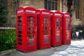 Row of vintage british red telephone boxes