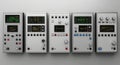 Row of vintage electronic test equipment devices with analog dials and displays Royalty Free Stock Photo